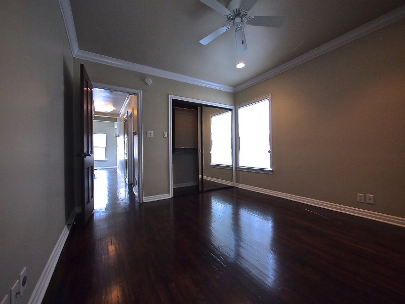 The master bedroom with large mirrored closet